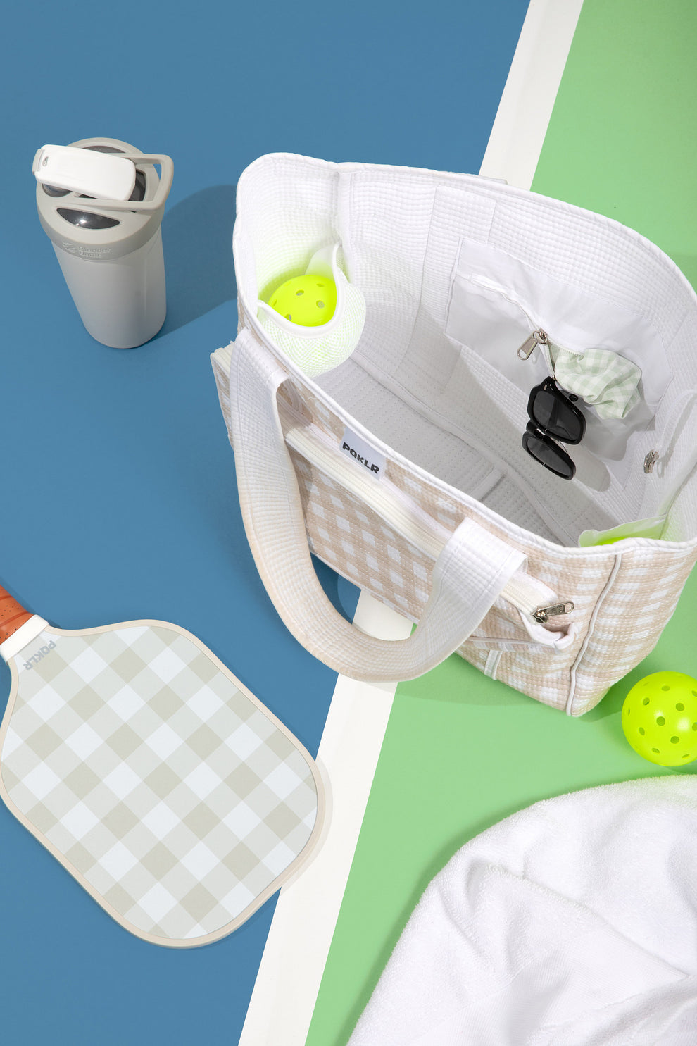 women's pickleball bag showing multiple compartments and organizational features for paddles and accessories